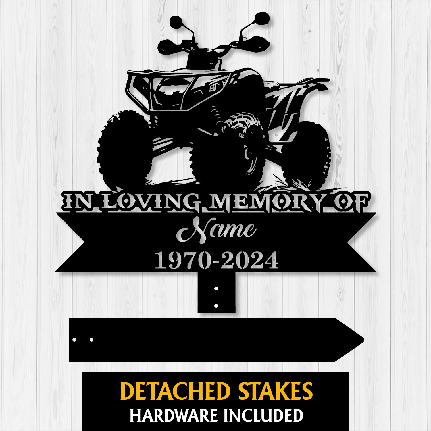Black memorial sign silhouette of an ATV with text 'IN LOVING MEMORY OF', 'Name' and '1970-2024' on a light wood background, with detached stake pieces shown