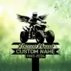 Black silhouette of a rider on an ATV with wings above a customizable memorial sign reading "Forever Loved" and "CUSTOM NAME 1960-2024" against a green grassy background