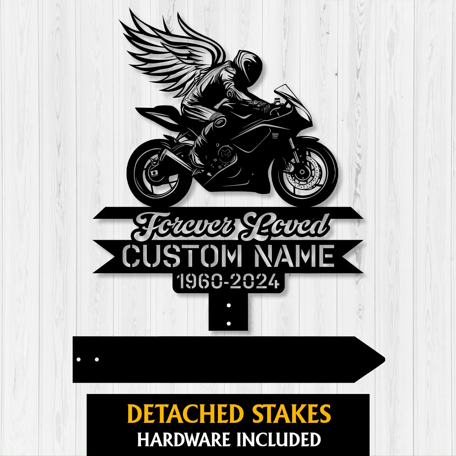 Black metal memorial sign of a winged motorcycle rider above text ribbons reading "Forever Loved," "CUSTOM NAME," and dates "1960-2024" on a white wood background