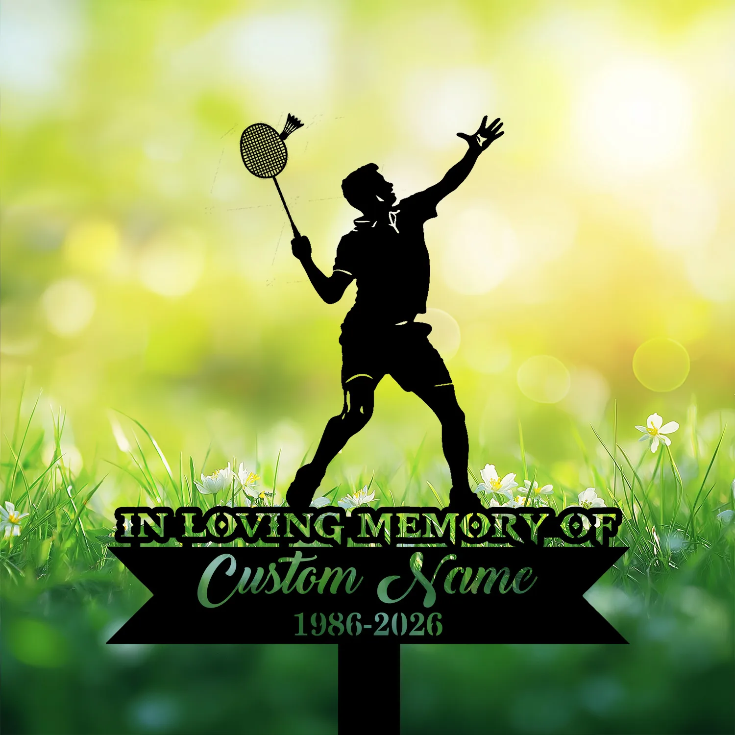 Badminton player memorial garden stake reading In Loving Memory of Custom Name 1986-2026 in a grassy flower setting