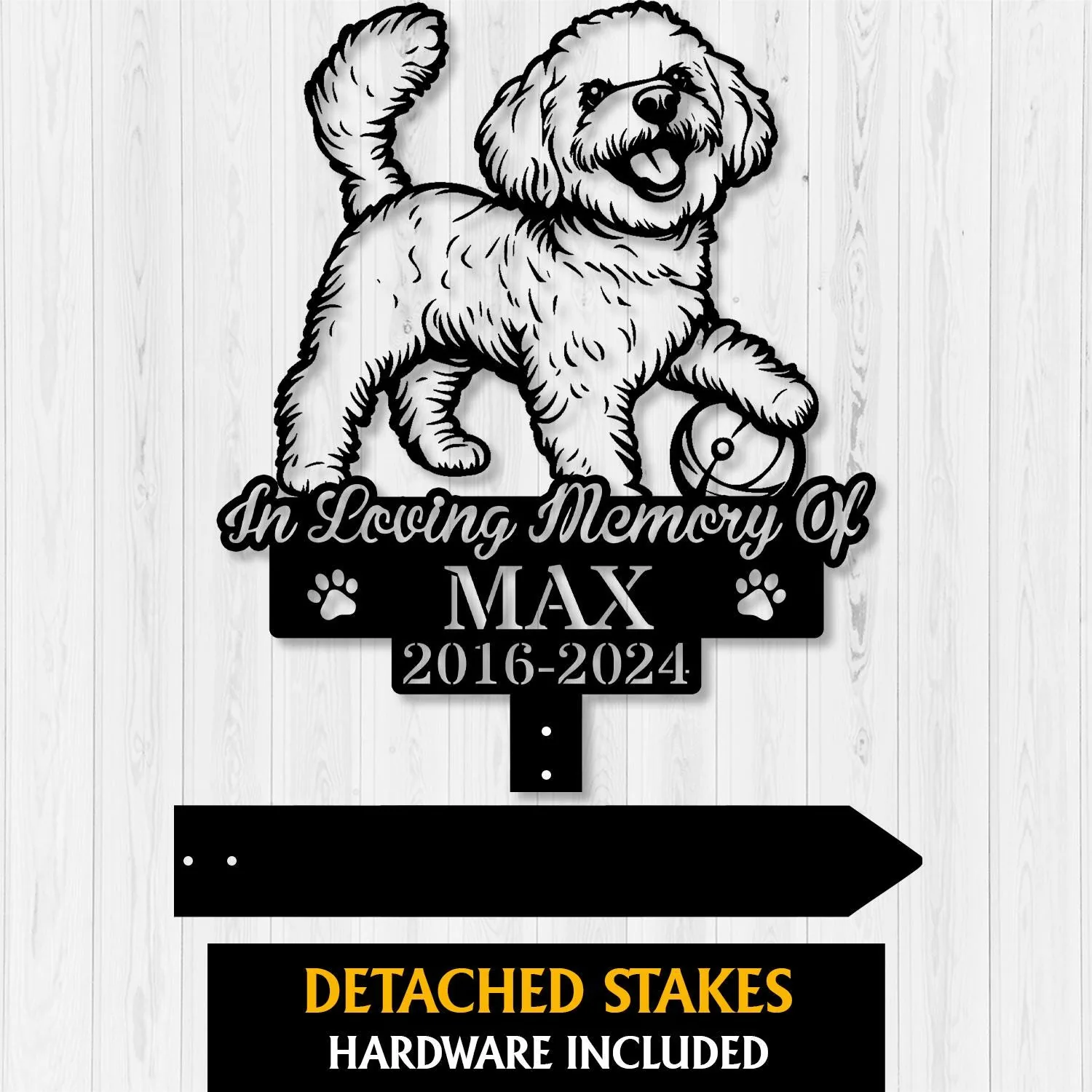 Black silhouette memorial sign of a happy small dog holding a ball with text "In Loving Memory Of MAX 2016-2024" on a light wood background