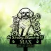 Black silhouette memorial sign of a fluffy dog surrounded by sunflowers reading "In Loving Memory Of" with name MAX and dates 2016-2024 on a green garden background