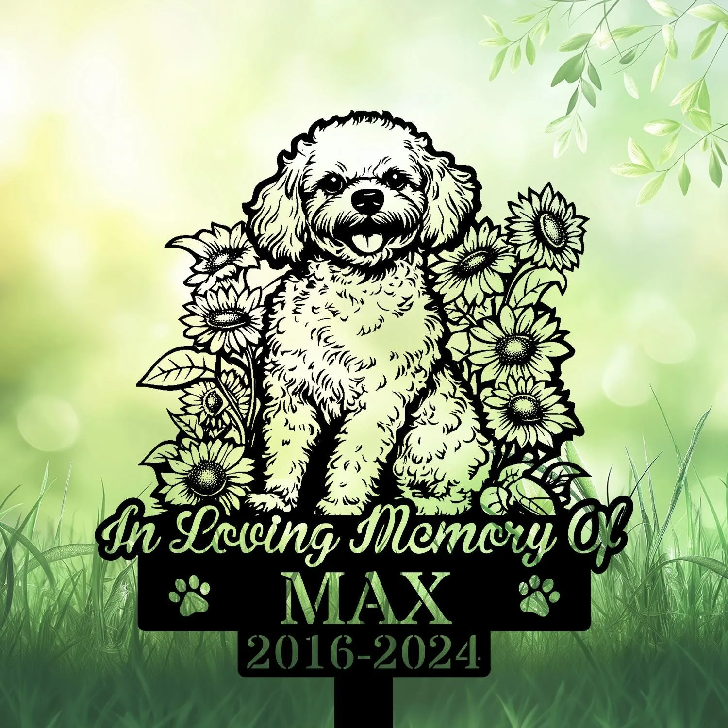 Black silhouette memorial sign of a fluffy dog surrounded by sunflowers reading "In Loving Memory Of" with name MAX and dates 2016-2024 on a green garden background