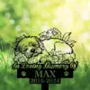 Grass and bokeh background with a memorial sign showing a sleeping dog surrounded by flowers and the text "In Loving Memory of MAX 2016-2024"