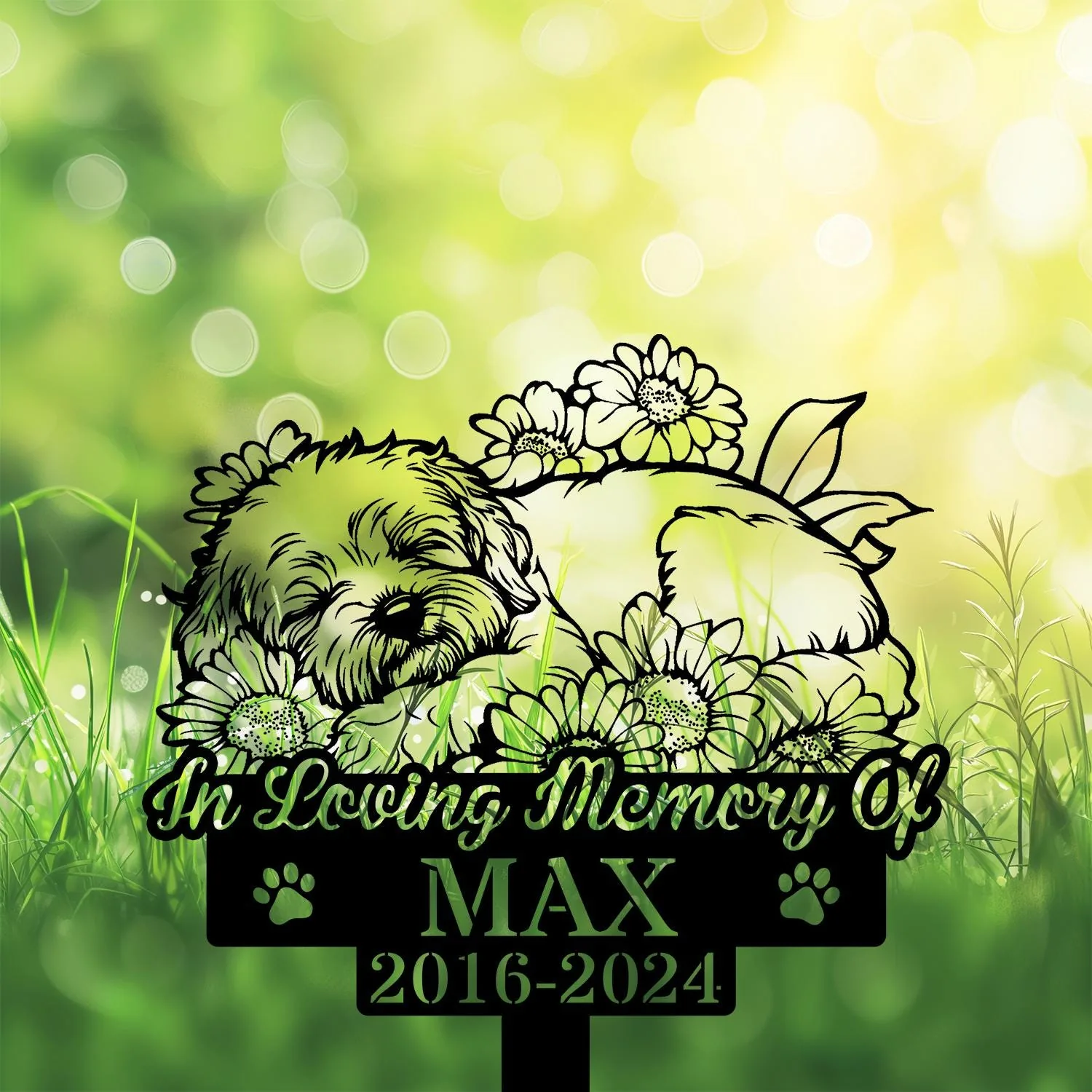 Grass and bokeh background with a memorial sign showing a sleeping dog surrounded by flowers and the text "In Loving Memory of MAX 2016-2024"