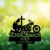 Biker-Kneeling-at-Cross-1 Silhouette memorial sign with kneeling man beside a cross and motorcycle, text 'In Loving Memory of DAD 1949-2024', on grassy blurred green background