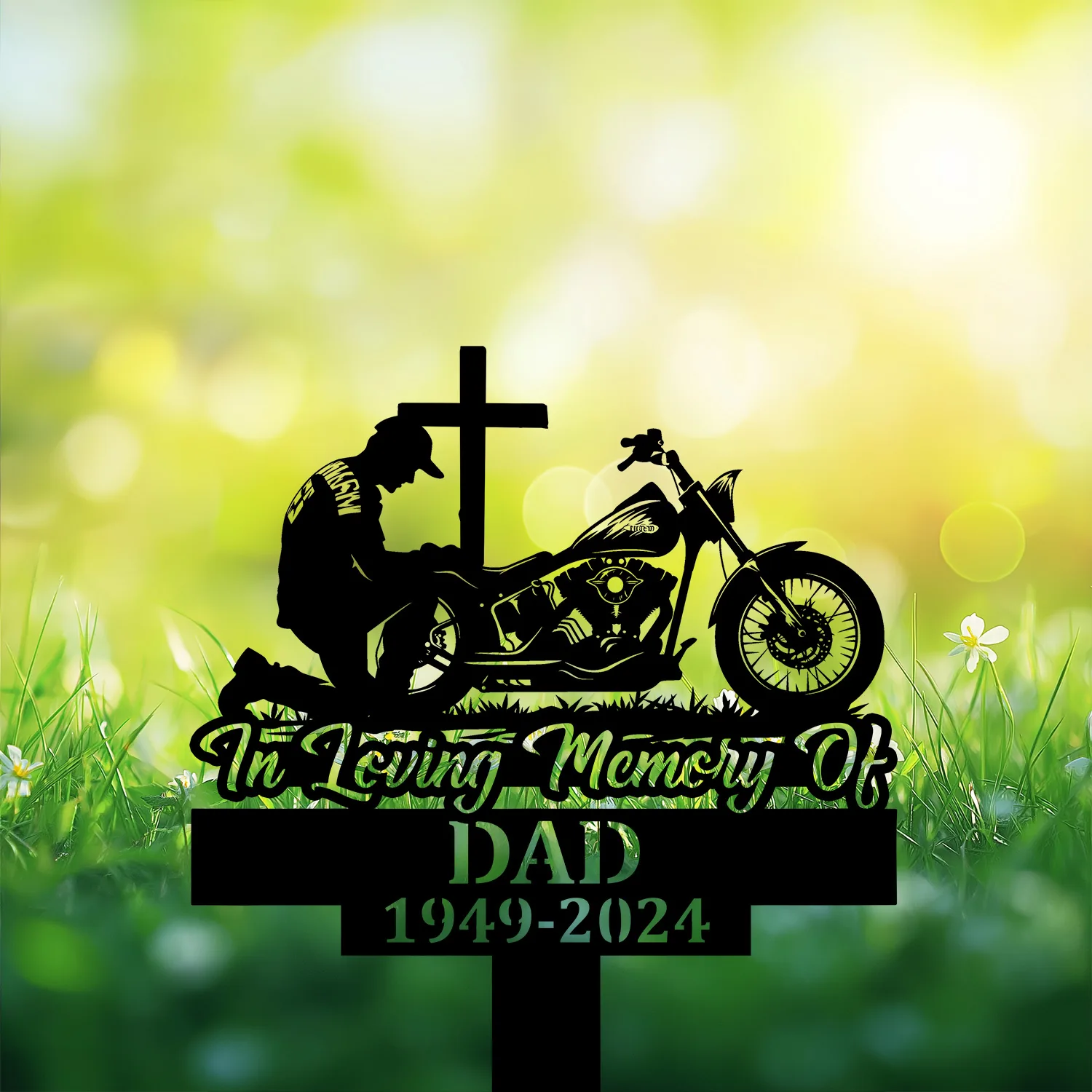 Biker-Kneeling-at-Cross-1 Silhouette memorial sign with kneeling man beside a cross and motorcycle, text 'In Loving Memory of DAD 1949-2024', on grassy blurred green background