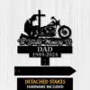 Biker-Kneeling-at-Cross-2 Black memorial sign silhouette of a kneeling motorcyclist, cross and motorcycle above text reading “In Loving Memory Of DAD 1949-2024,” shown on a light wood background