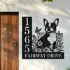 Boston-Terrier-Sitting-with-Butterfly-1 Black metal house sign mounted next to a wooden door showing address 15655 and text FAIRWAY DRIVE with a floral design and a sitting French bulldog silhouette