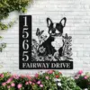 Boston-Terrier-Sitting-with-Butterfly-4-2 Black metal house sign on white brick wall showing numbers 1565 and text FAIRWAY DRIVE with a floral design and a French bulldog silhouette, pink flowers below