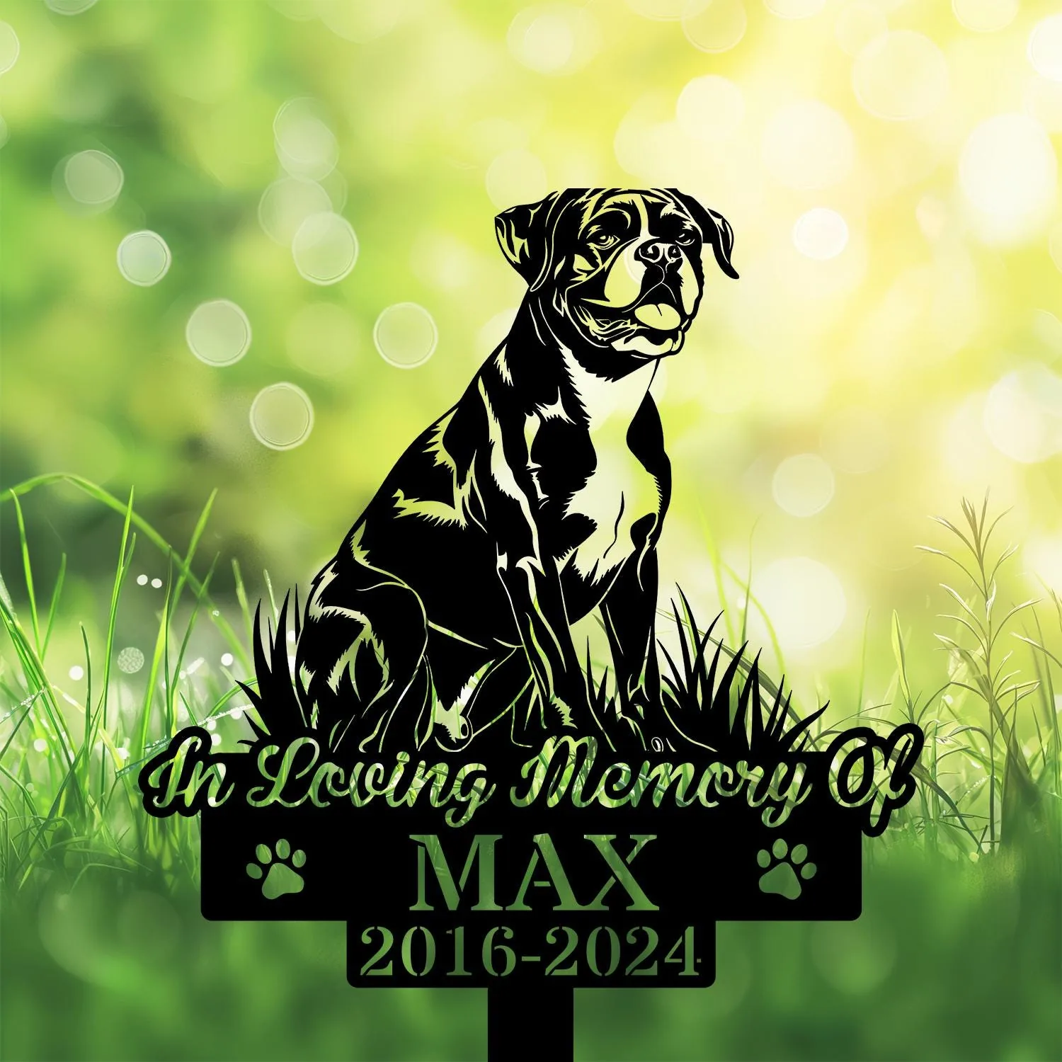 Boxer-4 Black silhouette memorial sign of a seated dog in grass with text "In Loving Memory of MAX 2016-2024" on a green bokeh background