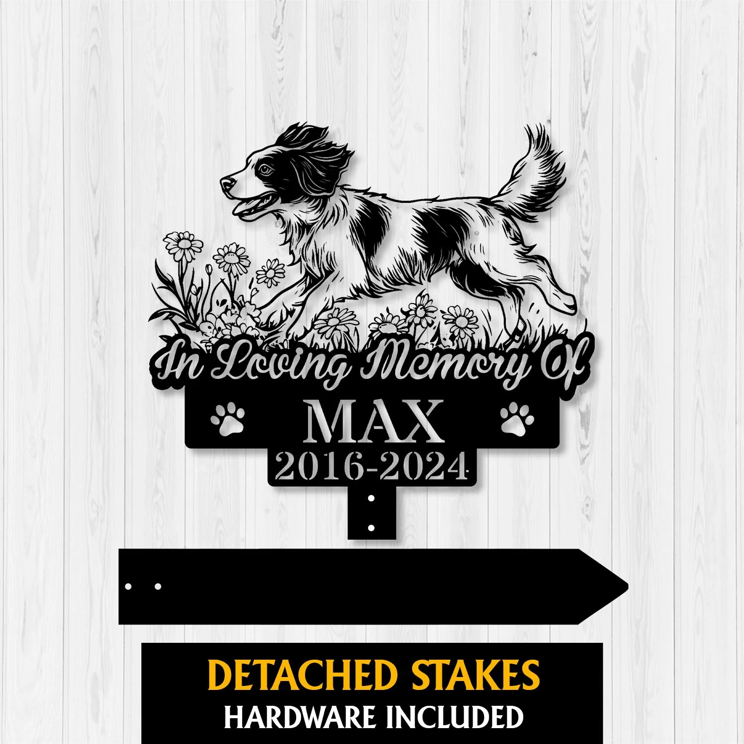 Black metal memorial sign for a dog named Max with running dog silhouette, flowers, paw prints and dates 2016-2024 on a light wood background
