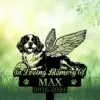 Black silhouette memorial sign of a happy dog with angel wings lying in grass, text “In Loving Memory Of” and name MAX with dates 2016-2024 on a soft green background