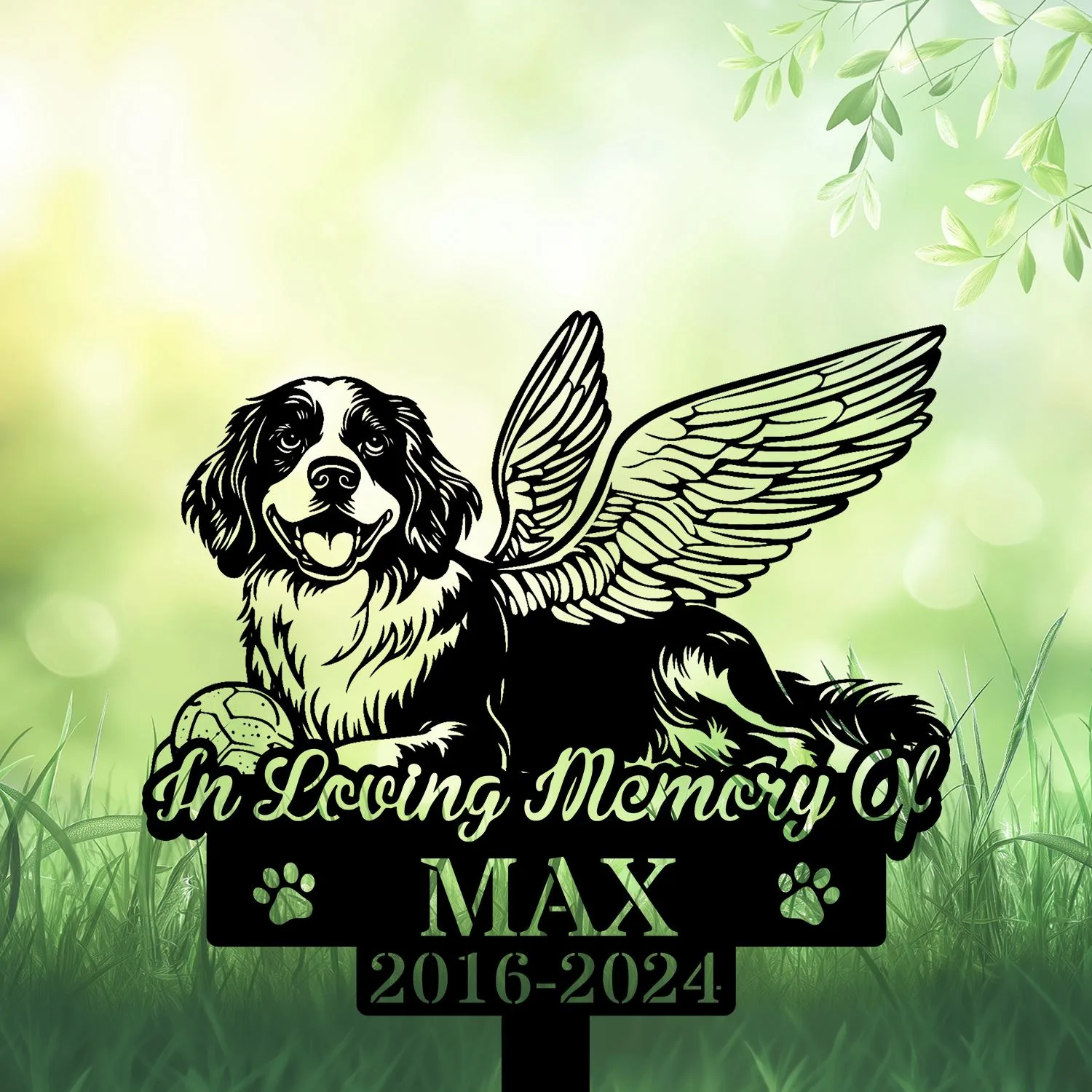 Black silhouette memorial sign of a happy dog with angel wings lying in grass, text “In Loving Memory Of” and name MAX with dates 2016-2024 on a soft green background