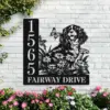 Cavalier-King-Charles-Spaniel-Sitting-with-Butterfly-4-2 Black metal house sign mounted on a white brick wall showing address numbers 1565 and text 'FAIRWAY DRIVE' with a dog illustration, flowers, butterflies and pink garden blooms below