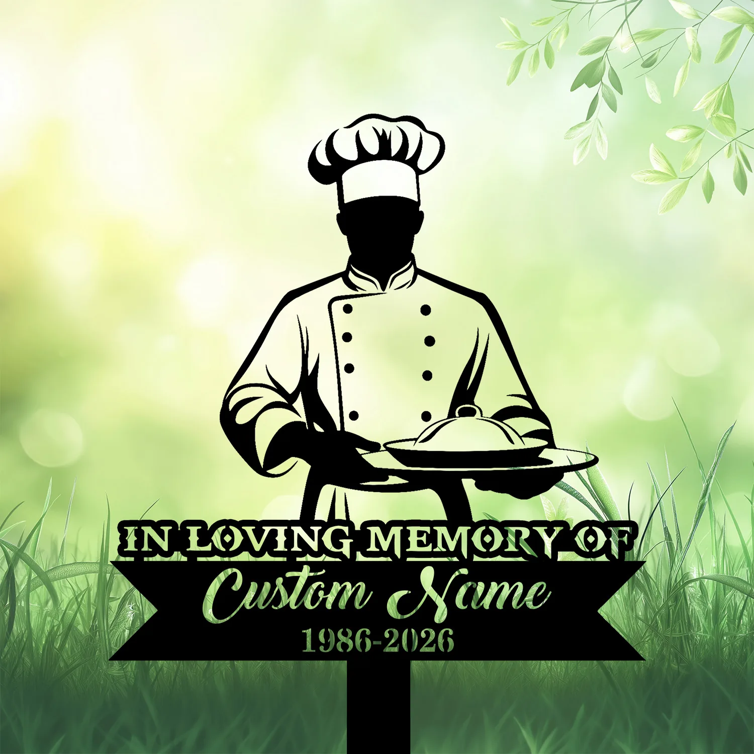 Chef-3 Chef memorial garden stake reading In Loving Memory Of Custom Name 1986-2026, shown in grass with leafy backdrop