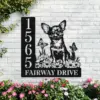 Chihuahua-Sitting-with-Butterfly-4-2 Black metal house address sign mounted on a white brick wall showing number 1565 and text "Fairway Drive" with a Chihuahua illustration, flowers and butterflies, surrounded by pink garden blooms