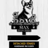 Black silhouette memorial sign with a happy corgi surrounded by sunflowers reading "In Loving Memory Of MAX 2016-2024" on a white wood background