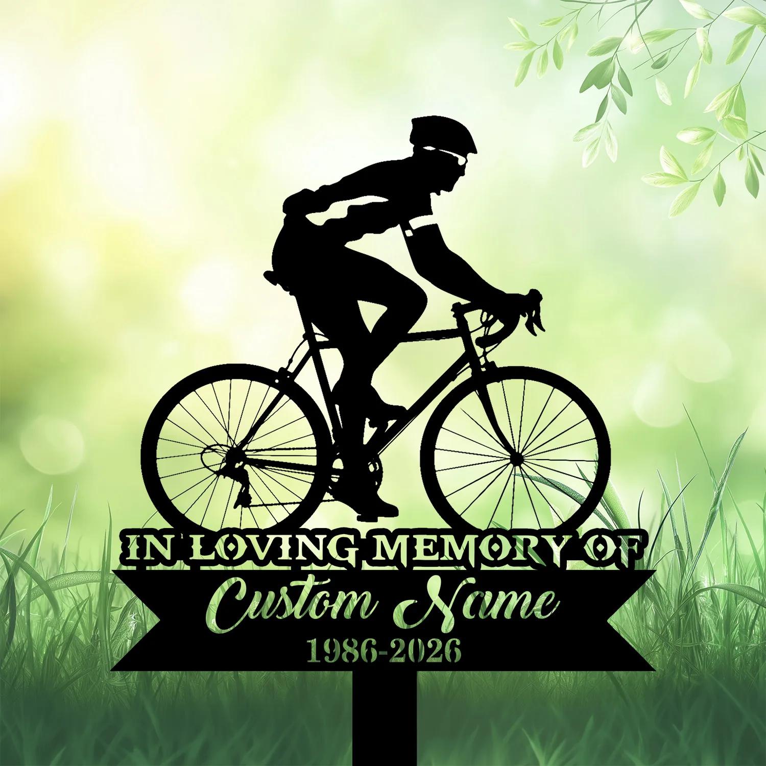 Cyclist-3 Black silhouette of a cyclist on a road bike above a memorial plaque reading "IN LOVING MEMORY" and placeholder "Custom Name 1986-2026" on a soft green outdoor background