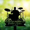 Black silhouette of a drummer at a drum kit over a green bokeh background with grass and flowers, text reading "In Loving Memory of" and placeholder "Custom Name 1986-2026"