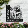 English-Bulldog-Sitting-with-Butterfly-4 Black metal house sign mounted on white brick showing numbers 1565 and text FAIRWAY DRIVE with a pug illustration, flowers and a butterfly, garden plants below
