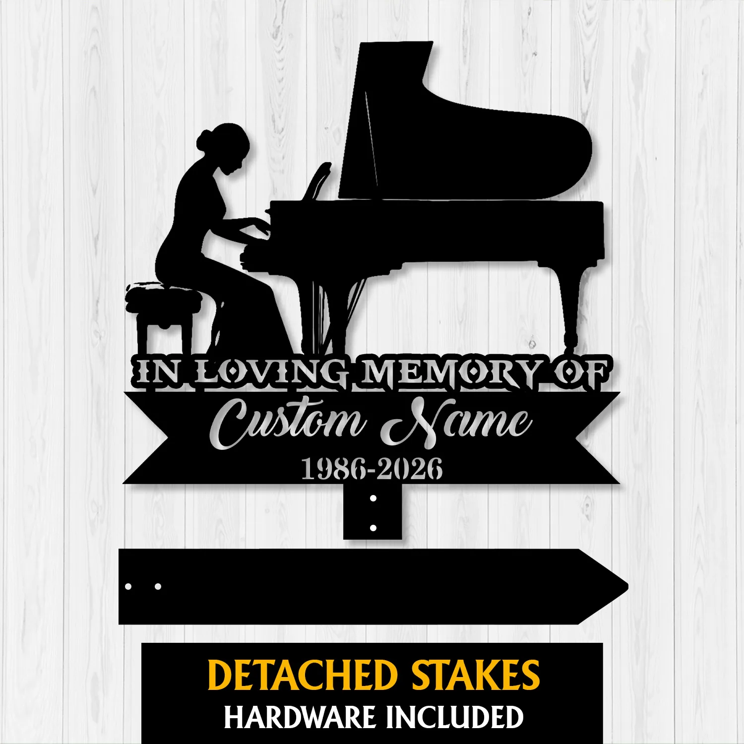 Black silhouette memorial sign showing a woman playing a grand piano with text 'In Loving Memory Of', placeholder 'Custom Name' and years '1986-2026' on a light wood background