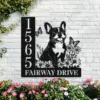 French-Bulldog-Sitting-with-Butterfly-3 Black metal house sign mounted on a white brick wall showing number 1565, a smiling French bulldog amid flowers and butterflies, text 'FAIRWAY DRIVE' and pink flowers below