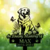 Memorial garden sign with a happy retriever illustration, butterflies, daisies and text reading "In Loving Memory Of MAX 2016-2024" against a soft green bokeh background