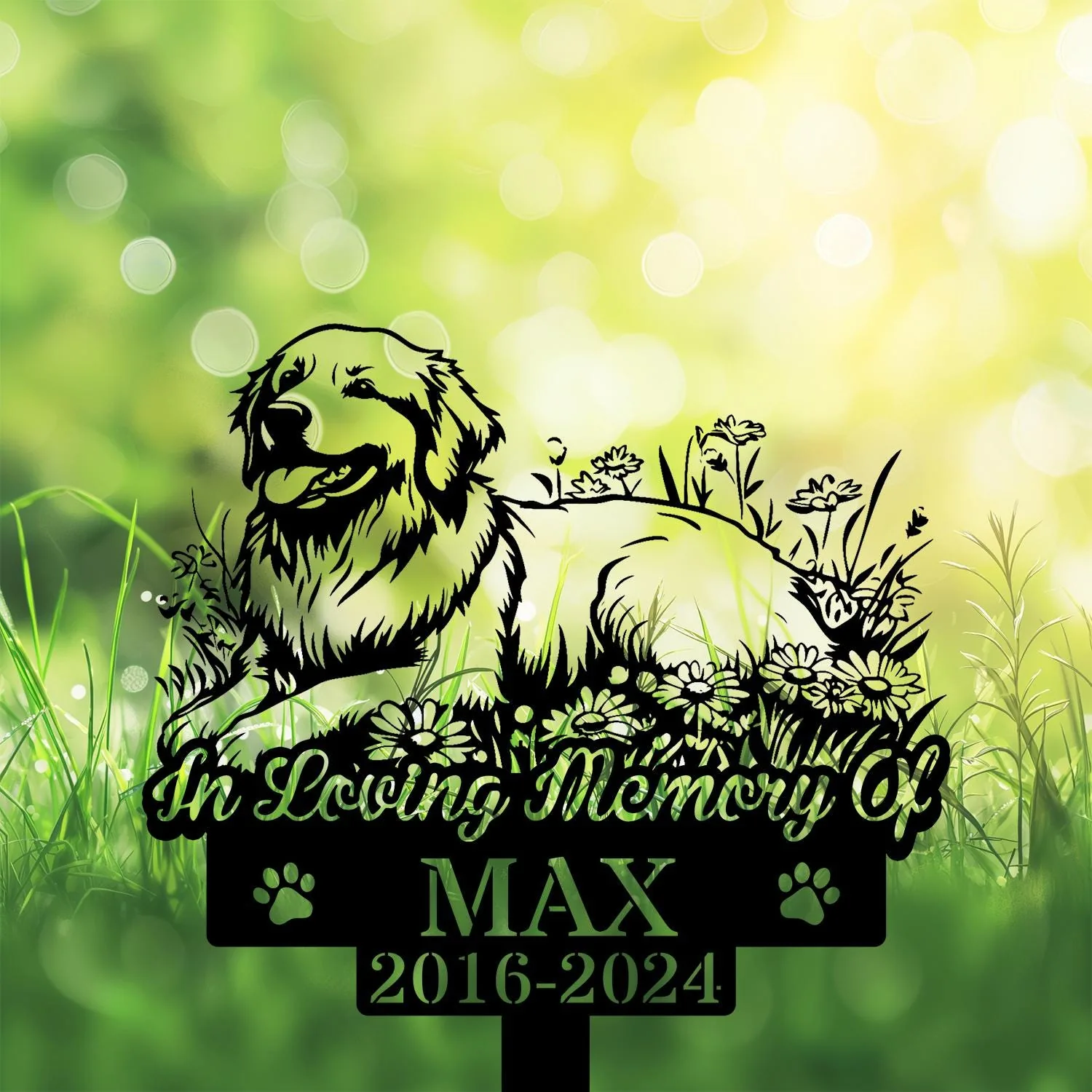 Black silhouette memorial sign of a smiling dog lying among flowers with text "In Loving Memory of MAX 2016-2024" on a bright green bokeh grassy background