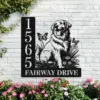 Black metal house sign on white brick with address numbers 1565 and text 'FAIRWAY DRIVE' beside a sitting golden retriever silhouette, butterflies and flowers, with pink blooms below