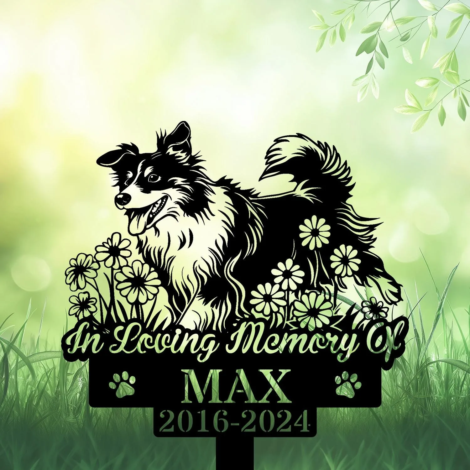 Shetland-Sheepdog-4 Black silhouette memorial yard sign of a happy long-haired dog among flowers reading "In Loving Memory of Max 2016-2024" against a soft green garden background