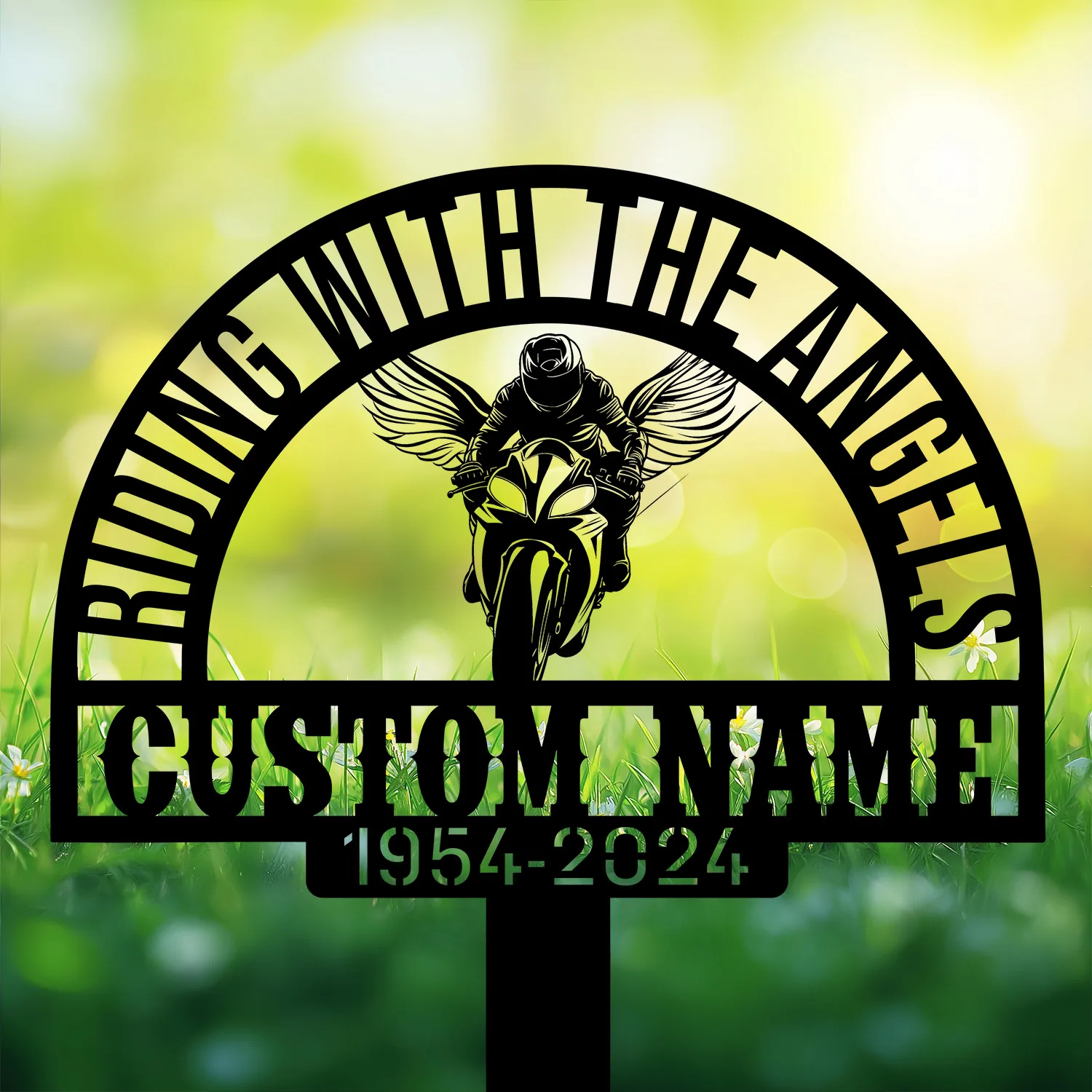 Sport-Biker-Riding-with-Angels-1 Black metal memorial sign with arched text “RIDING WITH THE ANGELS,” winged motorcyclist silhouette, customizable name and dates, shown against a sunlit grassy background