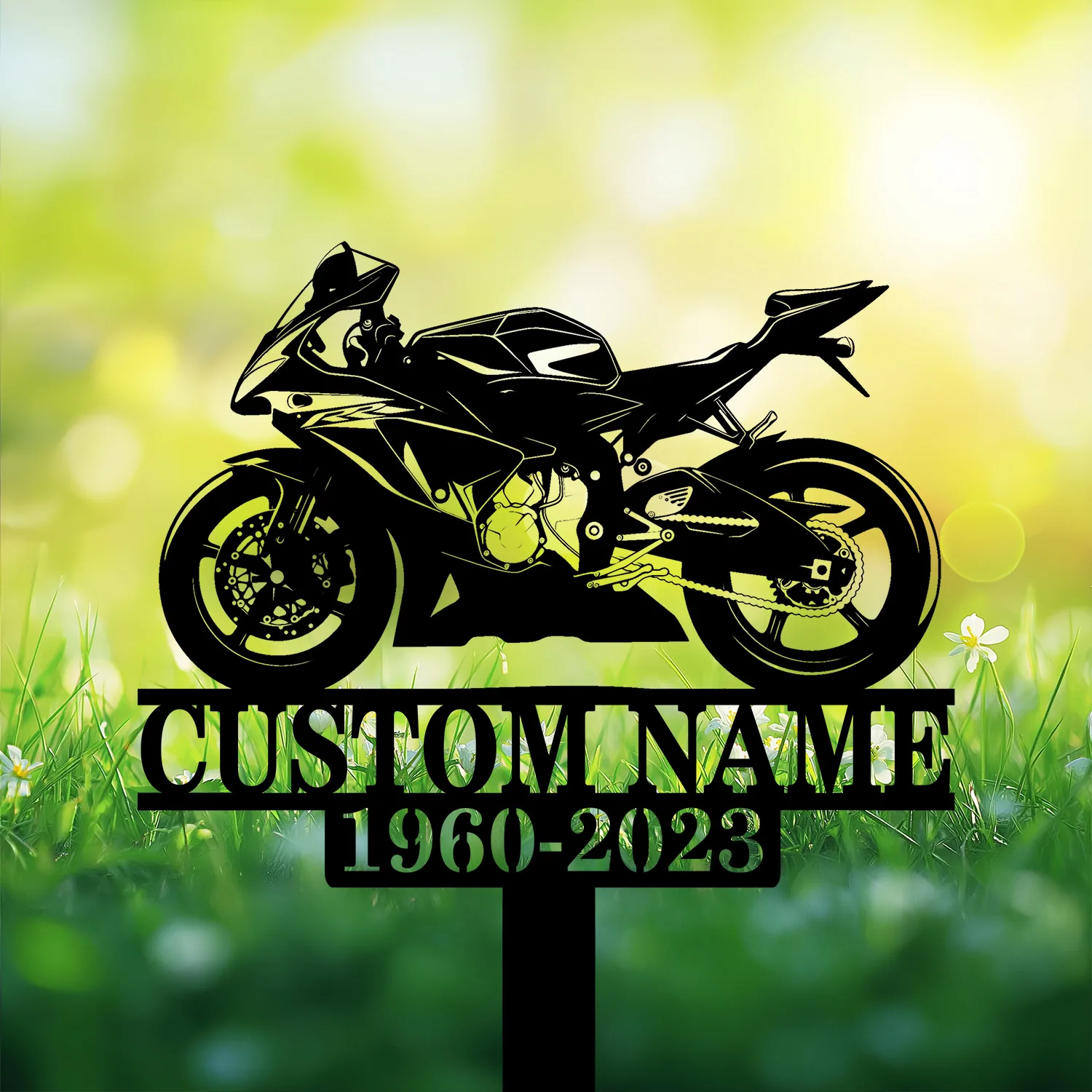 Sportbike-1 Black silhouette of a sport motorcycle on a decorative stake reading "CUSTOM NAME" with years "1960-2023" against a sunlit grassy background