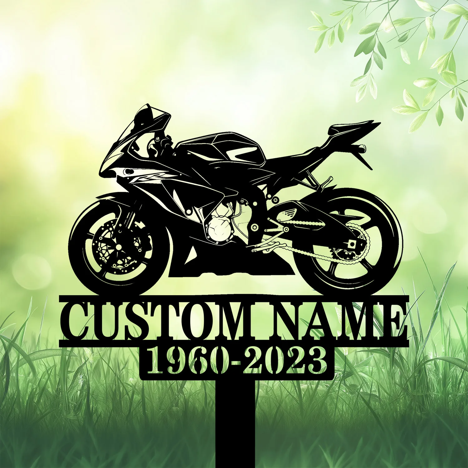 Sportbike-3 Black silhouette of a sport motorcycle on a garden stake with placeholder text "CUSTOM NAME" and dates "1960-2023" against a green blurred grass and leaf background