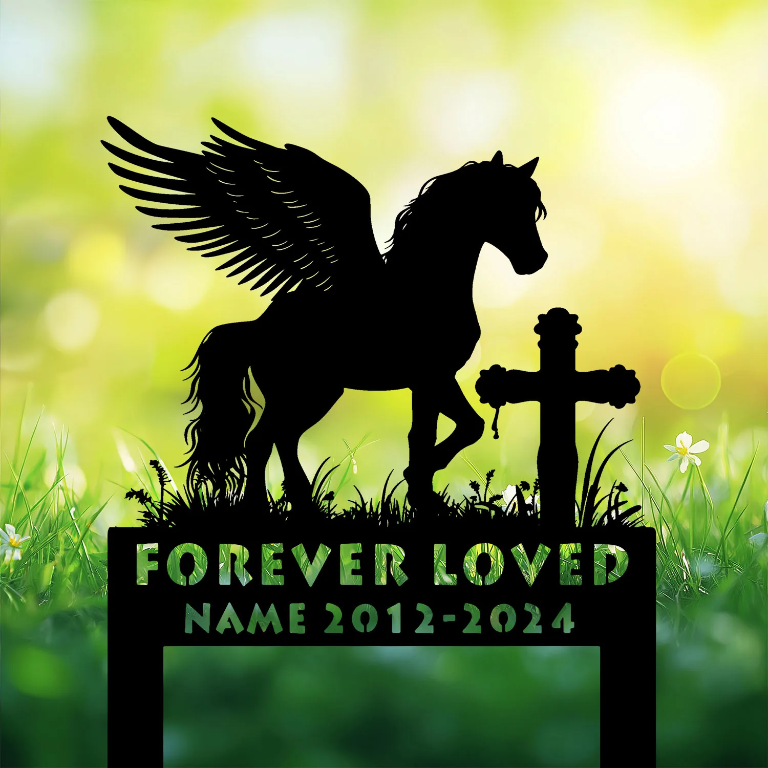 Black silhouette of a winged horse standing beside a cross over grassy field with 'FOREVER LOVED' and placeholder name 2012-2024 against a soft green bokeh background