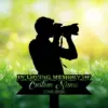 Black silhouette of a photographer with camera over a sunny green meadow background and a memorial sign reading "In Loving Memory" with placeholder "Custom Name" and dates 1986-2026