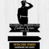 Black silhouette of a saluting soldier above a memorial sign reading "In Loving Memory of Custom Name 1986-2026" on a light wood background
