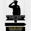 Black silhouette of a saluting police officer memorial sign reading "In Loving Memory of Custom Name 1986-2026" on a light wood background, detached stakes shown
