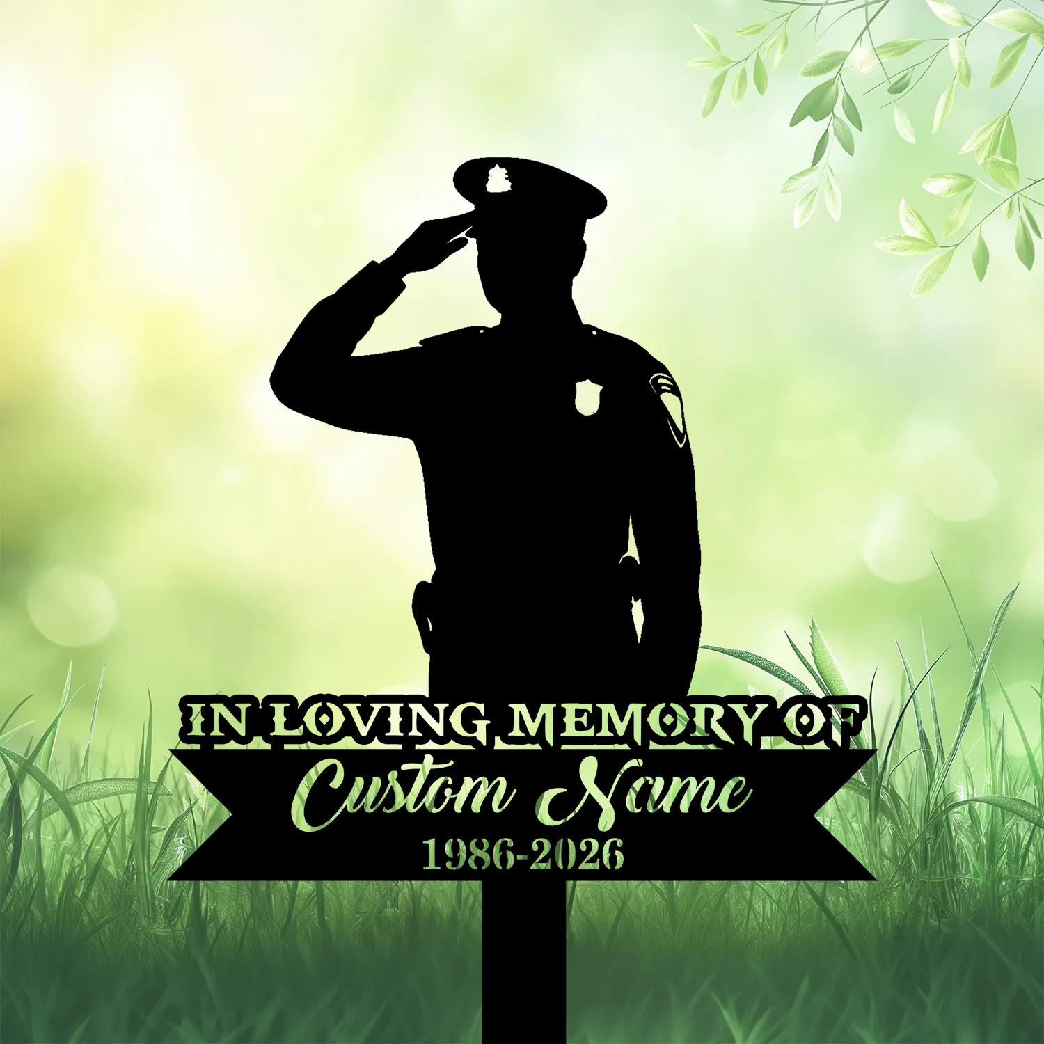 Silhouette of a saluting police officer over a grassy green memorial sign reading "In Loving Memory of Custom Name 1986-2026"