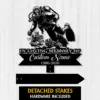 Style-15-Scuba-Diver-2 Black metal memorial sign showing a scuba diver over coral with text "In Loving Memory of" and customizable name and years, shown on a light wood background