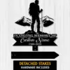 Black metal memorial sign silhouette of a hiker with mountains and text reading "In Loving Memory of Custom Name 1986-2026" on a white wood background