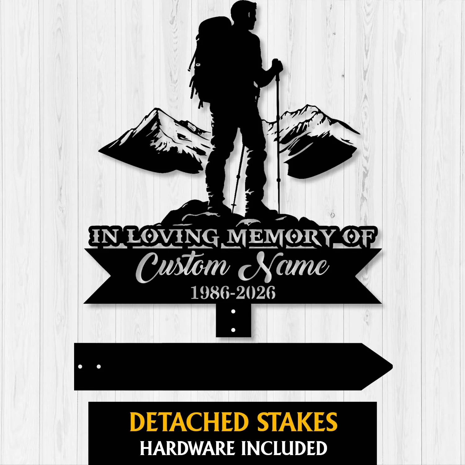 Black metal memorial sign silhouette of a hiker with mountains and text reading "In Loving Memory of Custom Name 1986-2026" on a white wood background