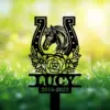 Style-20-horse-head-2-1 Black metal grave marker silhouette of a horse head inside a horseshoe with floral wreath, name LUCY and years 2016-2022 against sunlit grassy background