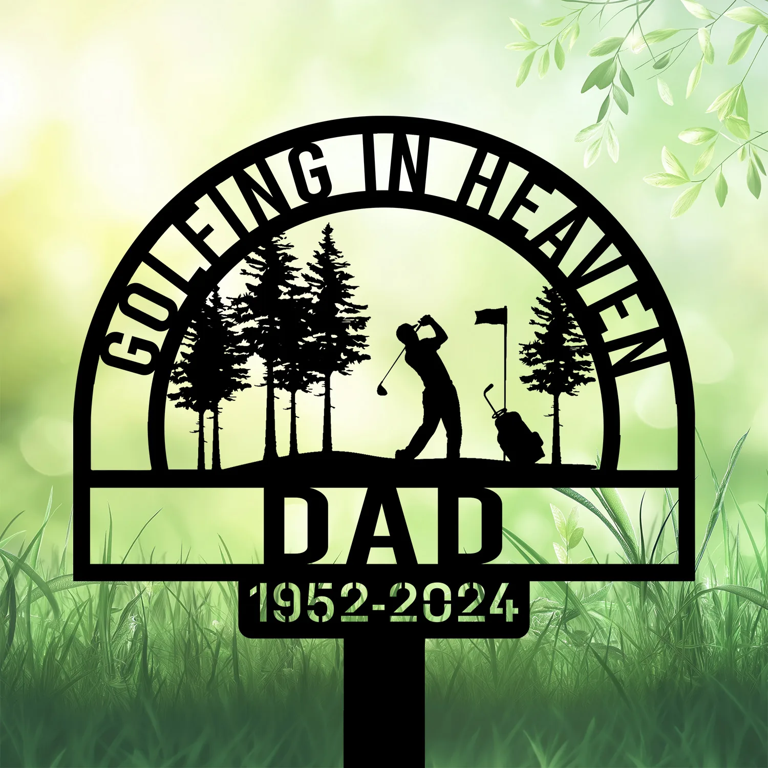 Black metal yard sign silhouette of a golfer swinging under trees with flag, text ‘Golfing in Heaven’ and ‘DAD 1952-2024’ on a soft green garden background