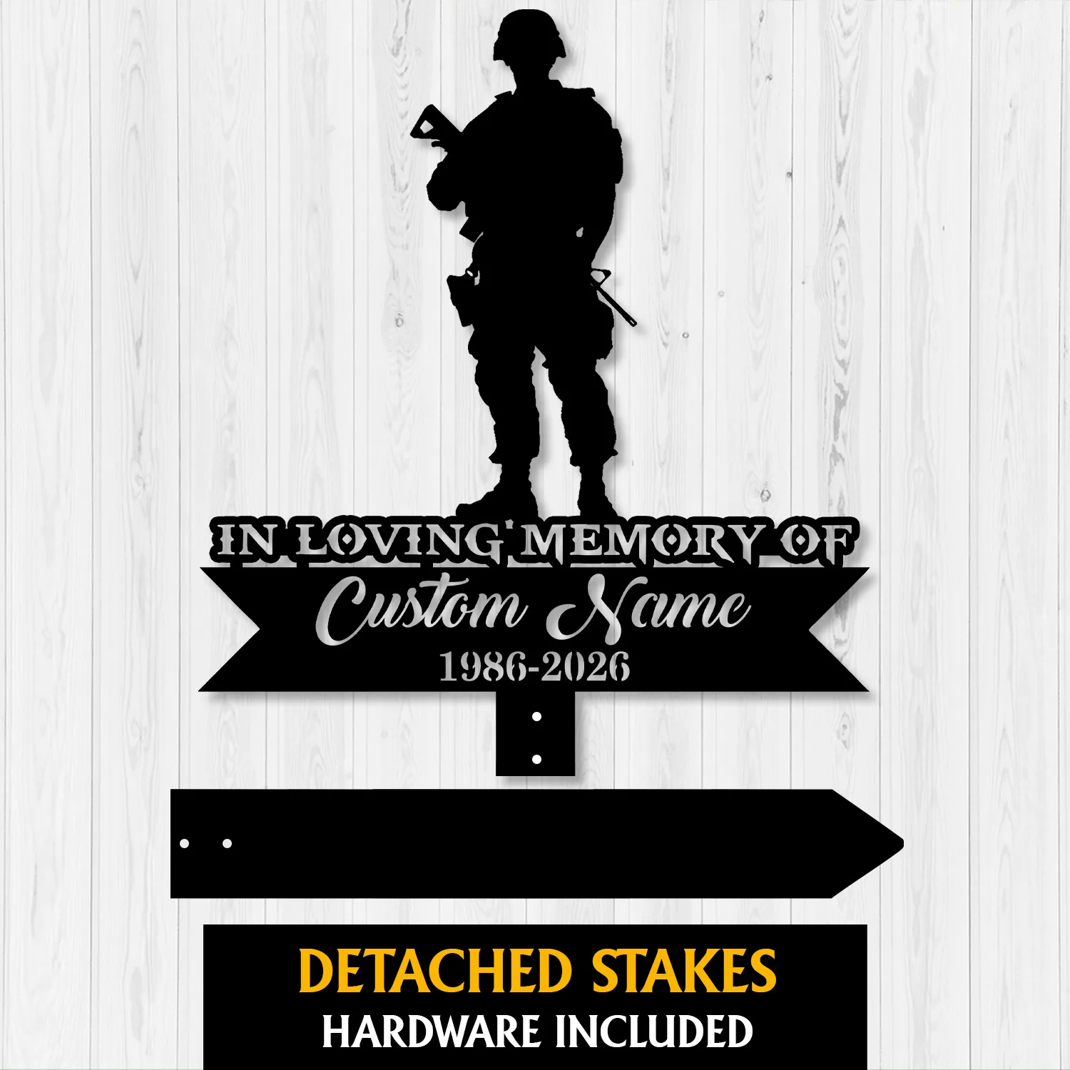 Black silhouette memorial sign of a soldier over text 'In Loving Memory of Custom Name 1986-2026' on a light wood plank background