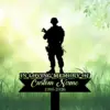 Silhouette of a soldier standing above a black memorial sign reading "In Loving Memory" with placeholder "Custom Name 1986-2026" on green grassy background
