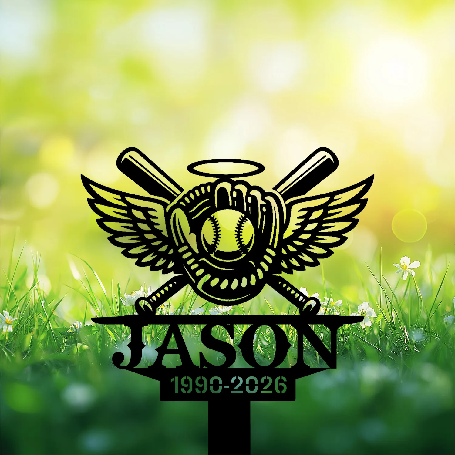 Black metal yard sign with winged baseball glove, ball and crossed bats above the name "JASON" and years "1990-2026" set against sunlit grassy background