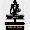 Black metal memorial yard sign silhouette of a football player wearing number 6 with text “In Loving Memory of Jason 1990-2026” on a light wood background