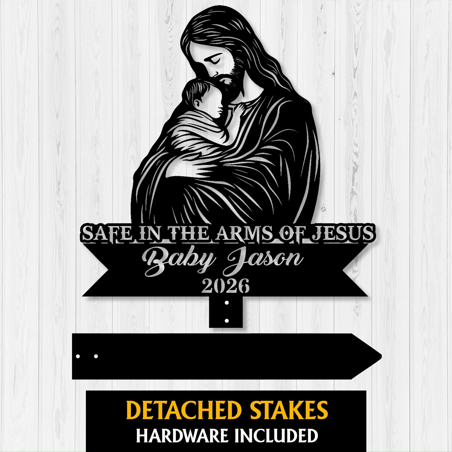 Style-24-Baby-with-Jesus-2 Black silhouette sign of Jesus holding a baby with text “Safe in the Arms of Jesus” and “Baby Jason 2026” on a light wood background