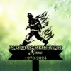 Black silhouette memorial yard sign of a firefighter with stylized flames, text reading "IN LOVING MEMORY OF", placeholder "Name" and dates "1970-2024" against a soft green grassy background